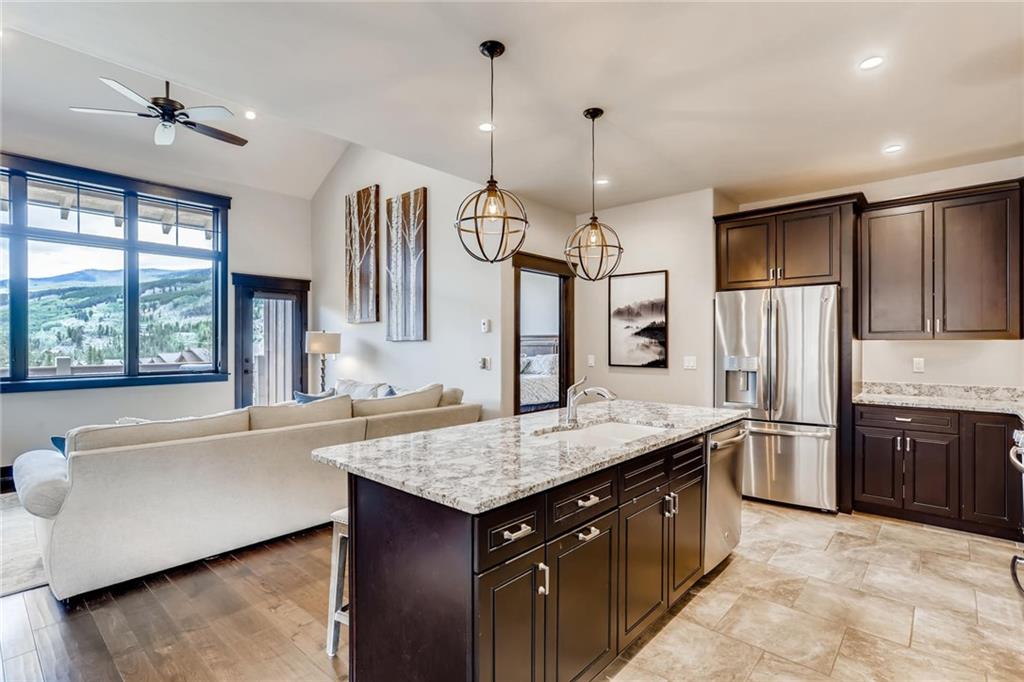851 Independence Road, Unit 5A Keystone, CO 80435 - Photo 8 of 28 a kitchen with stainless steel appliances granite countertop a sink stove and refrigerator