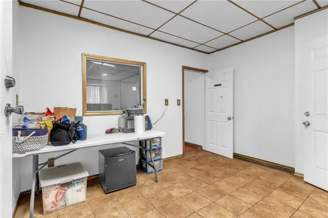 a room with a desk and a sink