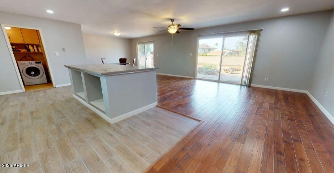 4216 West Solano Drive Phoenix, AZ 85019 - Photo 2 of 13 a view of a kitchen with a sink and a microwave
