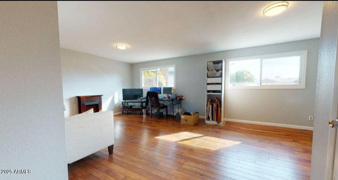 4216 West Solano Drive Phoenix, AZ 85019 - Photo 7 of 13 a view of livingroom with furniture and wooden floor