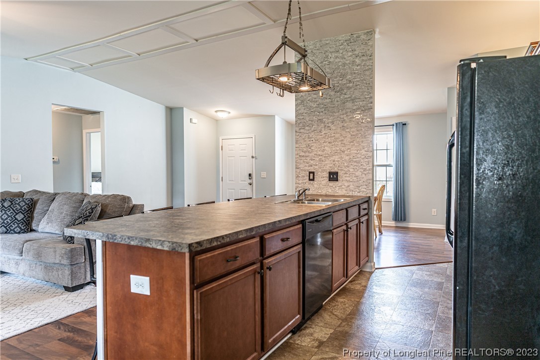 20 Old English Lane Spring Lake, NC 28390 - Photo 15 of 41 a bathroom with a granite countertop sink a toilet and a mirror