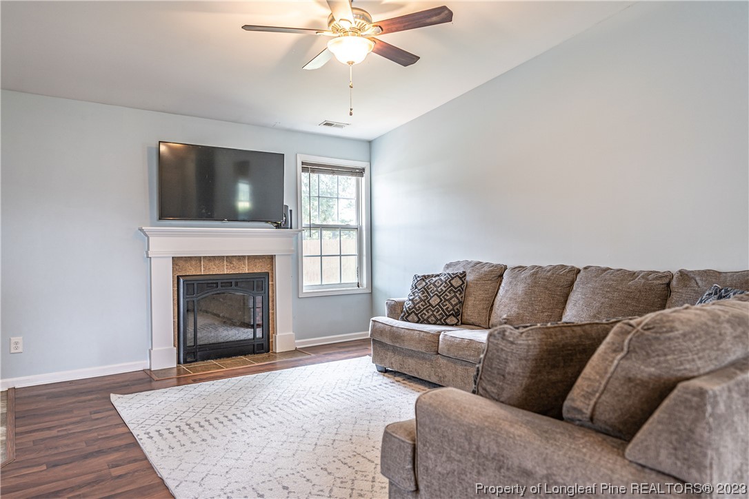 20 Old English Lane Spring Lake, NC 28390 - Photo 16 of 41 a living room with a couch and a fireplace