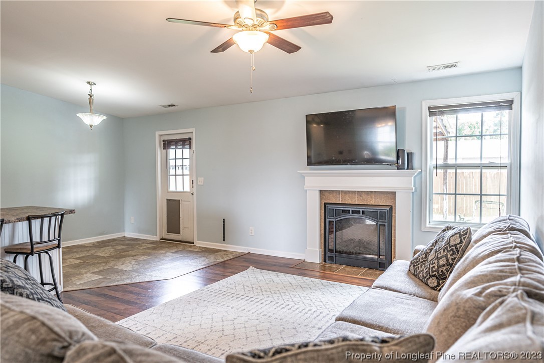 20 Old English Lane Spring Lake, NC 28390 - Photo 17 of 41 a living room with furniture a fireplace and a flat screen tv