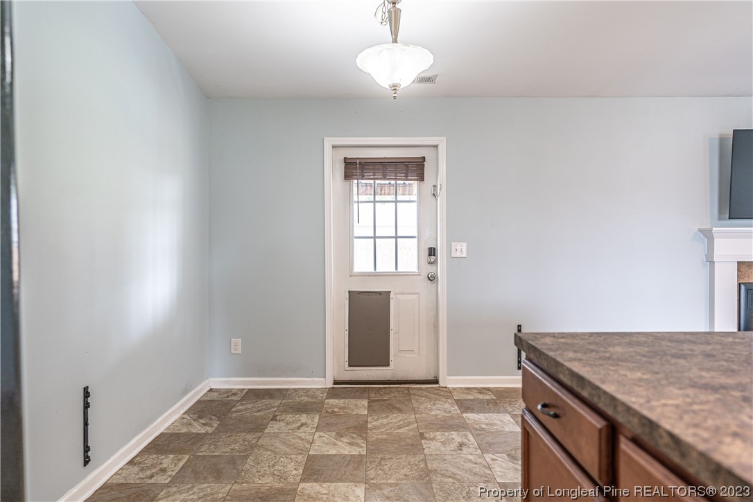 20 Old English Lane Spring Lake, NC 28390 - Photo 21 of 41 an empty room with wooden floor and windows