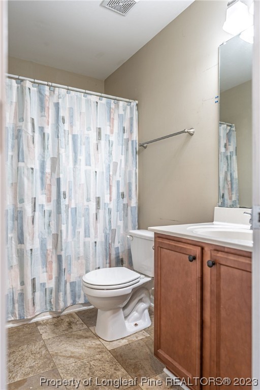20 Old English Lane Spring Lake, NC 28390 - Photo 32 of 41 a bathroom with a toilet a sink and a shower