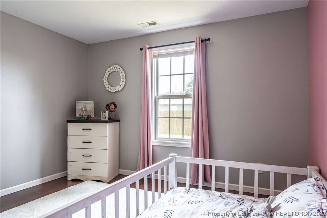 20 Old English Lane Spring Lake, NC 28390 - Photo 38 of 41 a bedroom with a bed and a window