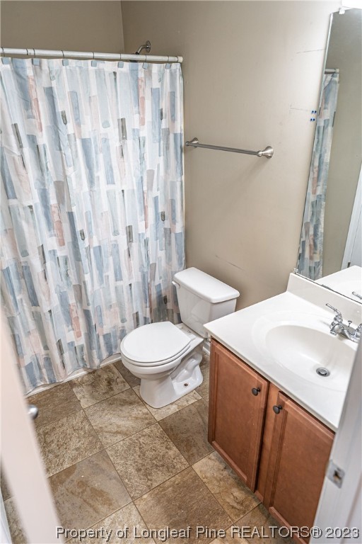20 Old English Lane Spring Lake, NC 28390 - Photo 41 of 41 a bathroom with a sink a toilet and shower curtain