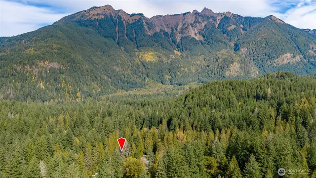 an aerial view of a house with yard swimming pool and outdoor seating