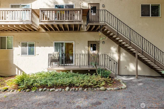a view of front of house with potted plants