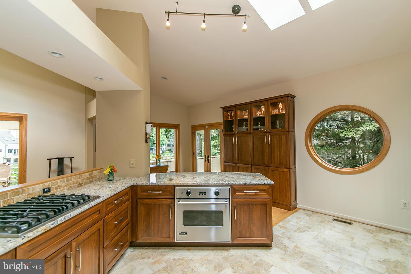 11580 Lake Newport Road Reston, VA 20194 - Photo 11 of 30 a kitchen with stainless steel appliances granite countertop a stove and a sink