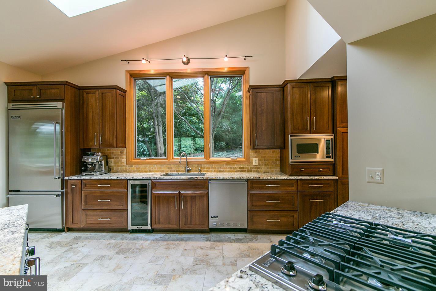 11580 Lake Newport Road Reston, VA 20194 - Photo 13 of 30 a kitchen with stainless steel appliances granite countertop a stove and a sink