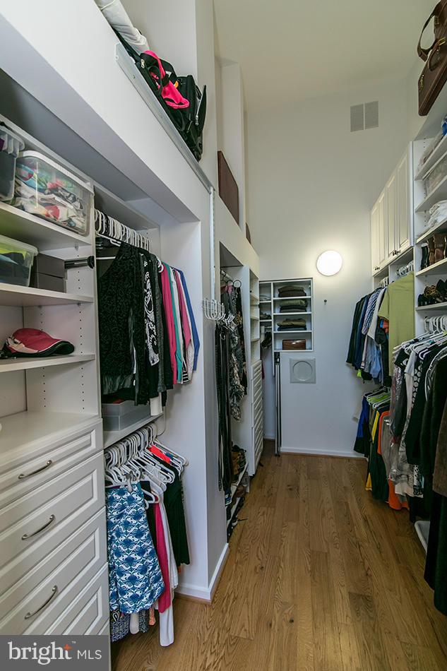 11580 Lake Newport Road Reston, VA 20194 - Photo 19 of 30 a view of walk in closet with clothes and shoes