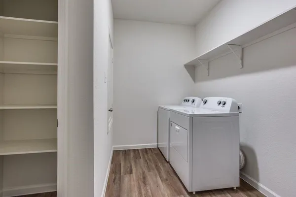 a utility room with washing machine