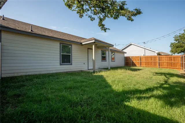 a view of a backyard with plants