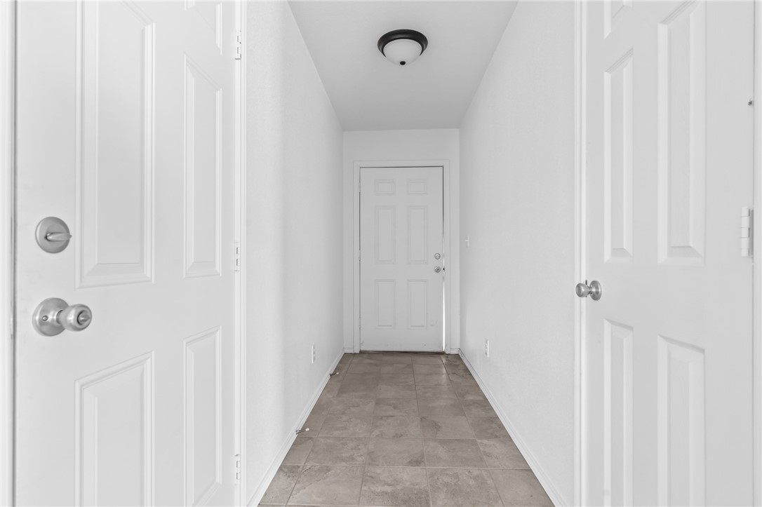 413 Whitney Court Rio Vista, TX 76093 - Photo 5 of 34 a view of a hallway with wooden floor
