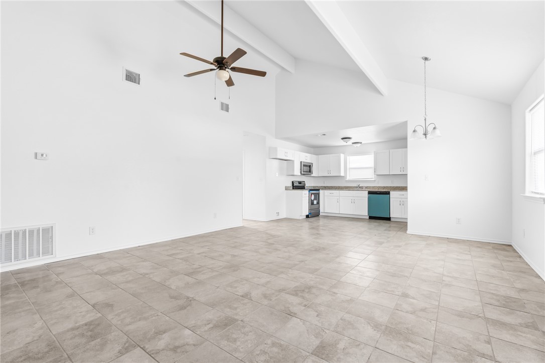 413 Whitney Court Rio Vista, TX 76093 - Photo 7 of 34 a view of a kitchen with a sink and a refrigerator
