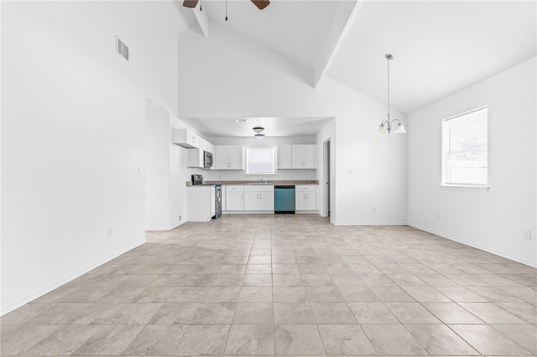 413 Whitney Court Rio Vista, TX 76093 - Photo 8 of 34 a view of a kitchen with a sink and windows