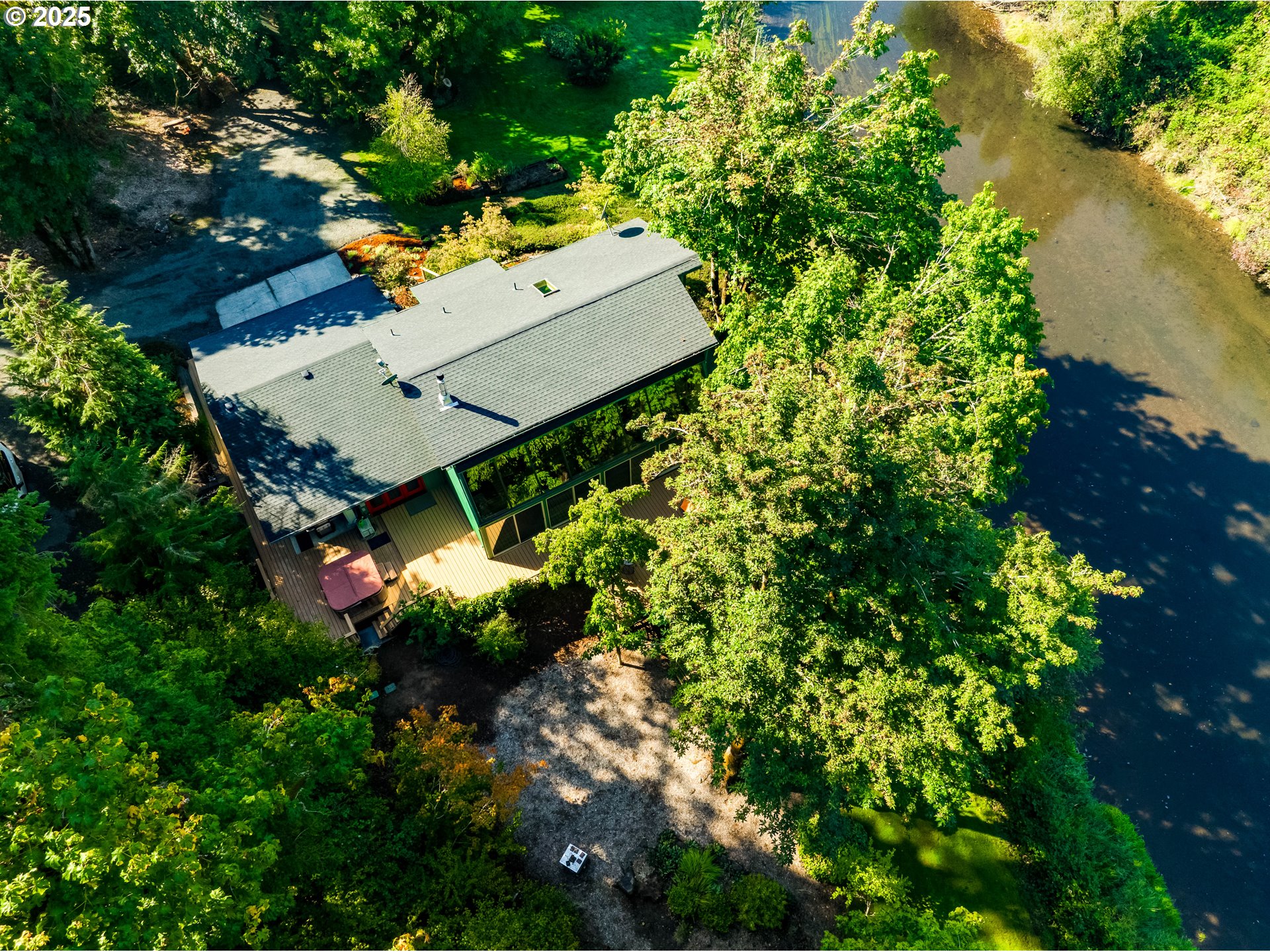 90498 Sunderman Road Springfield, OR 97478 - Photo 3 of 47 an aerial view of a house with a yard and lake view