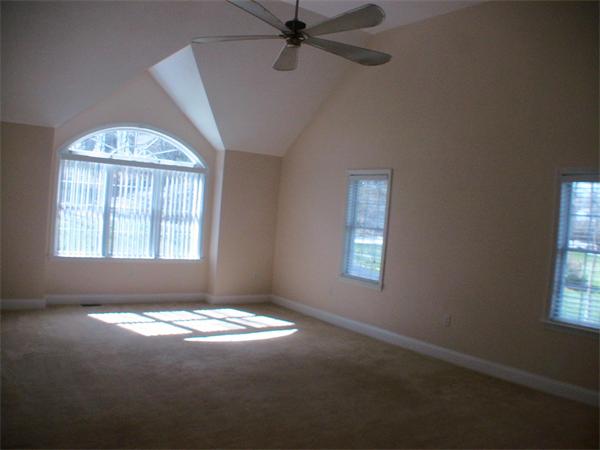 30 Corbin Road Dudley, MA 01571 - Photo 2 of 9 an empty room with windows