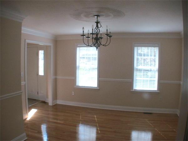 30 Corbin Road Dudley, MA 01571 - Photo 4 of 9 a view of an empty room with wooden floor and a window