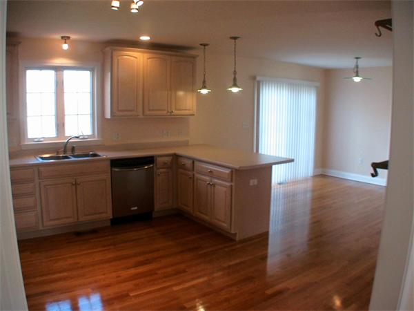 30 Corbin Road Dudley, MA 01571 - Photo 5 of 9 a kitchen with a sink a window and wooden floor