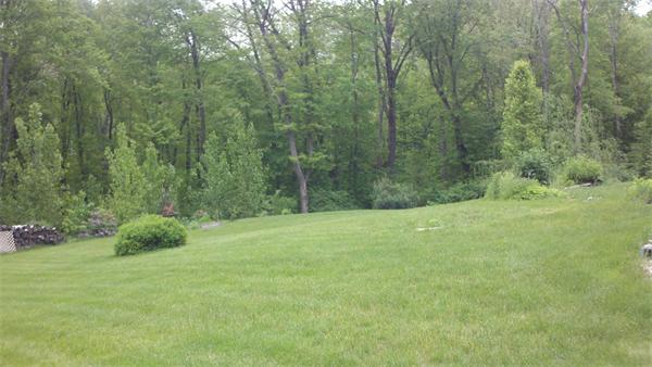 30 Corbin Road Dudley, MA 01571 - Photo 9 of 9 a view of a grassy field with trees