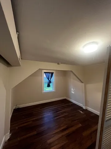 a view of a livingroom with wooden floor