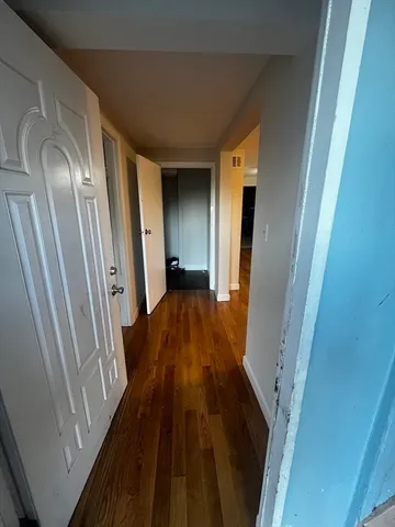 a large kitchen with a stove top oven and cabinets