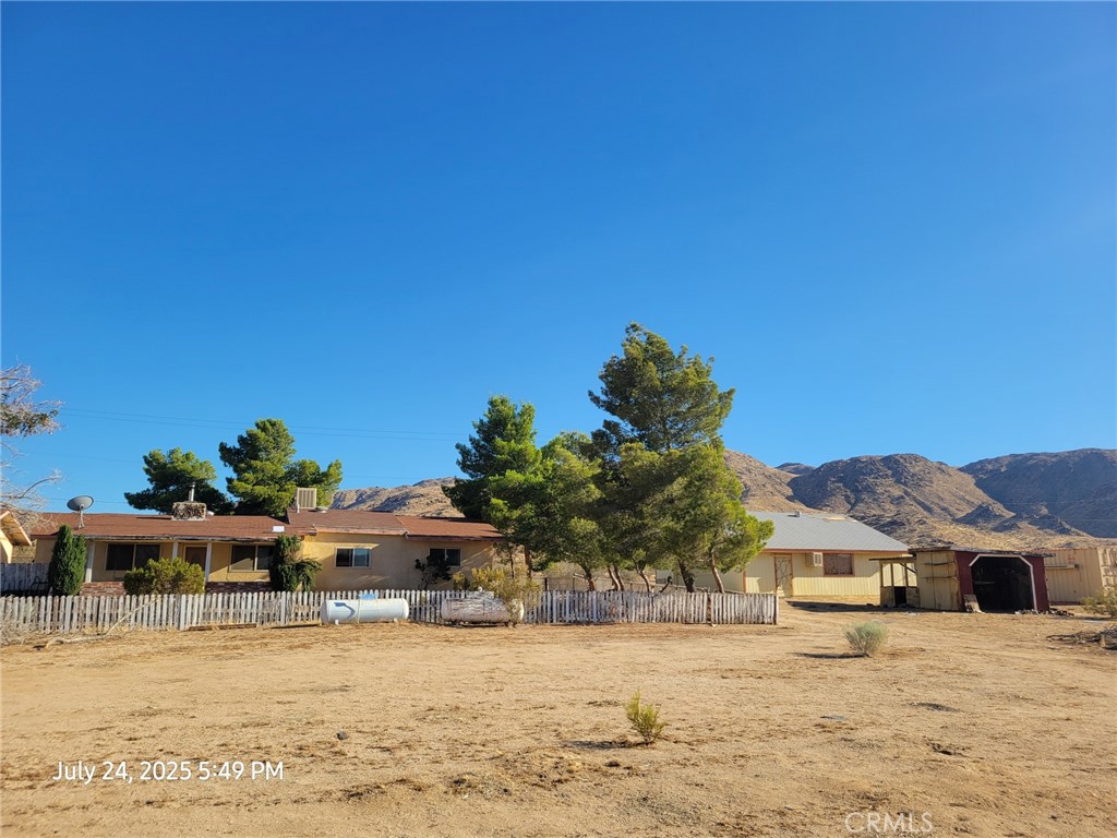27177 Cahuilla Road Apple Valley, CA 92307 - Photo 2 of 75 a front view of a house with a yard and garage