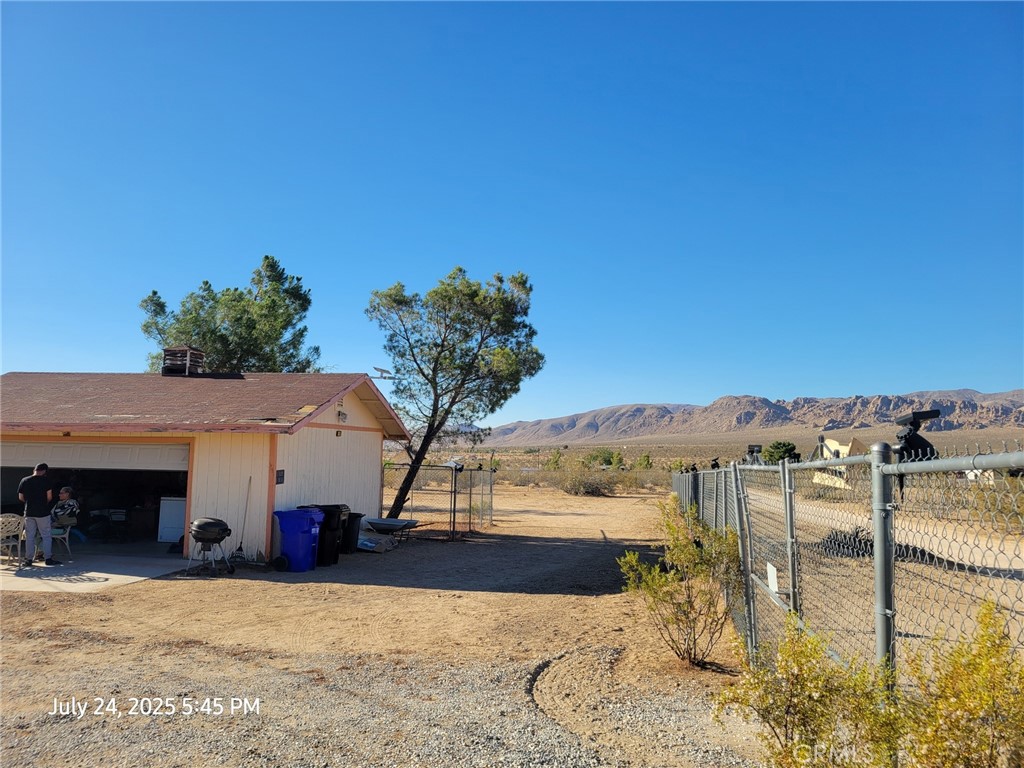 27177 Cahuilla Road Apple Valley, CA 92307 - Photo 34 of 75 a view of a terrace with a table and chairs