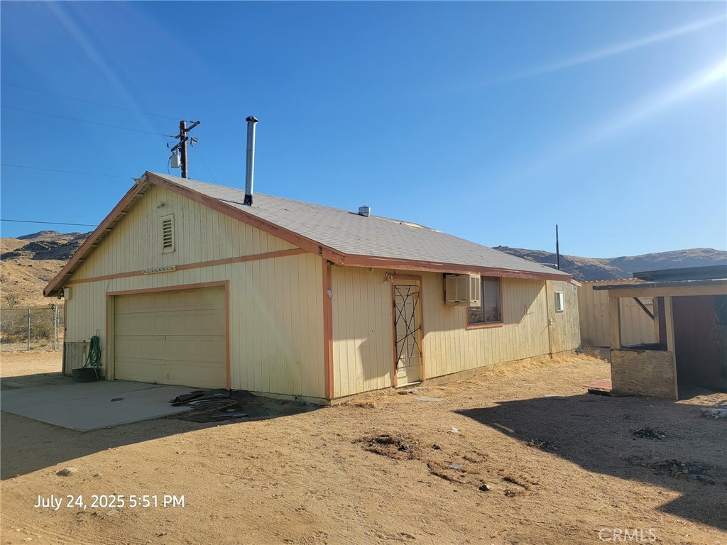 27177 Cahuilla Road Apple Valley, CA 92307 - Photo 44 of 75 a front view of a house with a yard