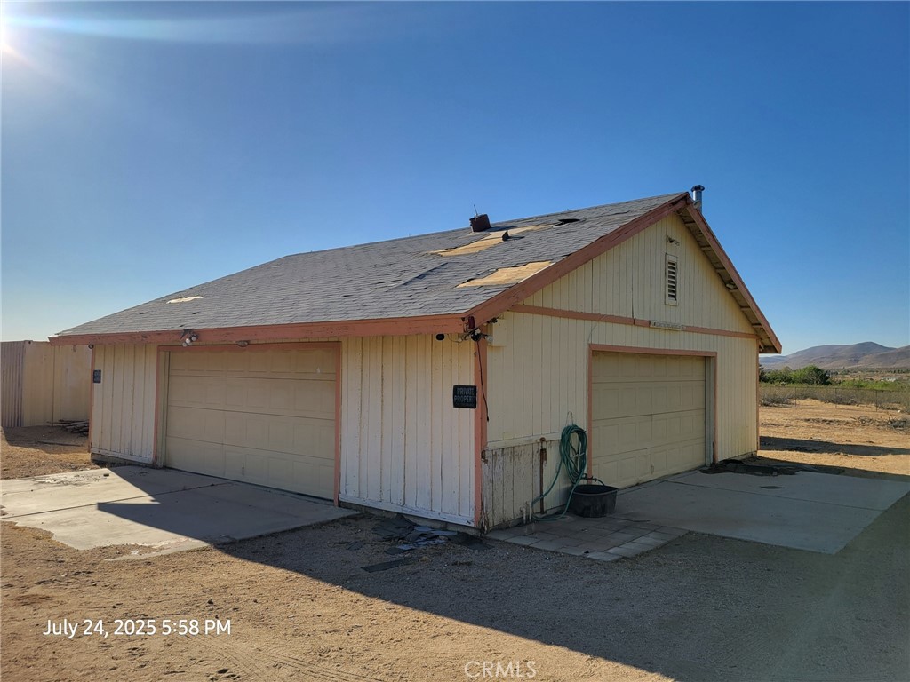 27177 Cahuilla Road Apple Valley, CA 92307 - Photo 55 of 75 a view of a house with a garage