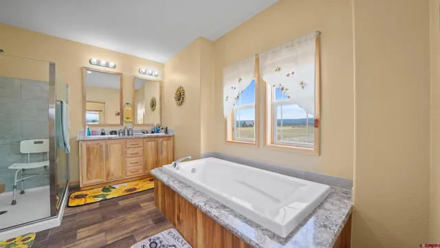 a view of kitchen with granite countertop sink and wooden floor