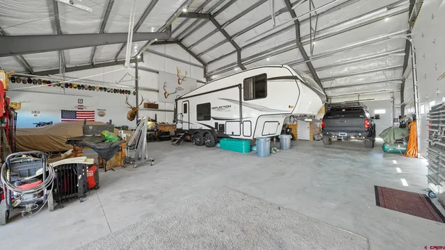 a view of parking garage with cars