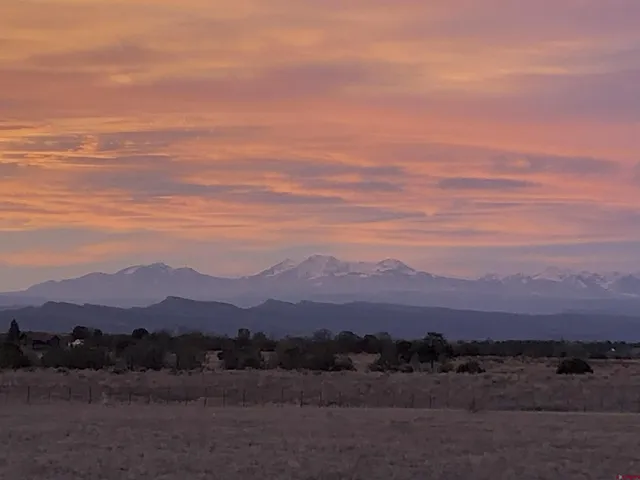 a view of sunset and a mountain