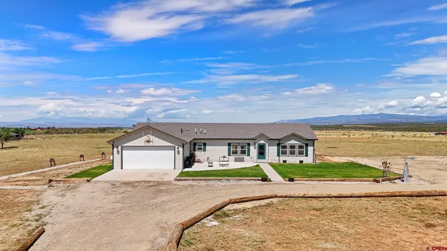 a view of an ocean with a building in the background