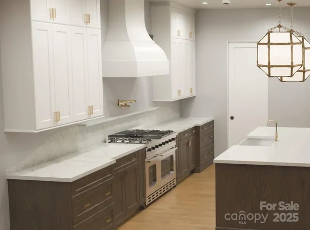 a kitchen with a stove and a white cabinet