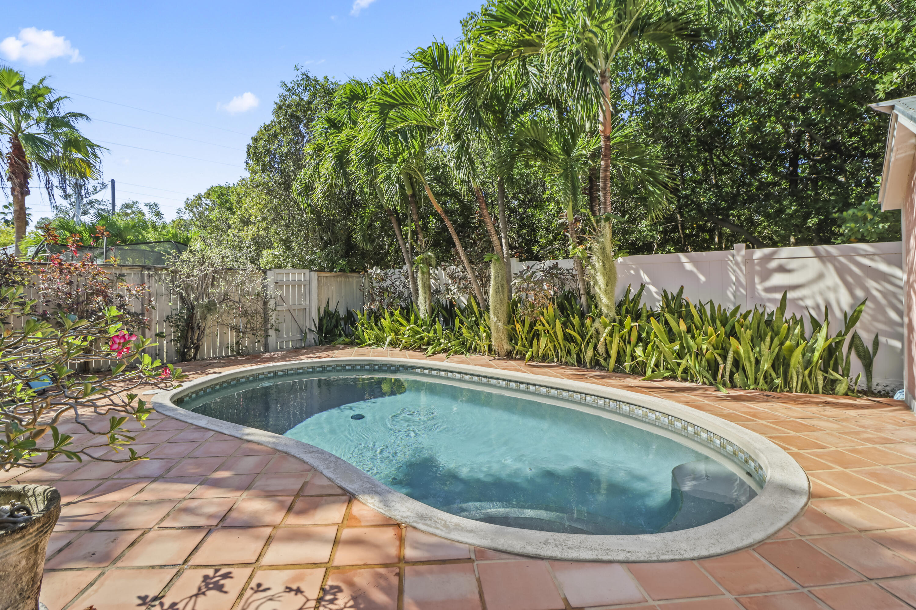 1406 Sunset Drive Key West, FL 33040 - Photo 1 of 23 a view of a swimming pool with a patio