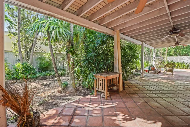 a patio with yard table and chairs