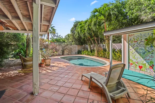 a view of a chairs and table in the patio