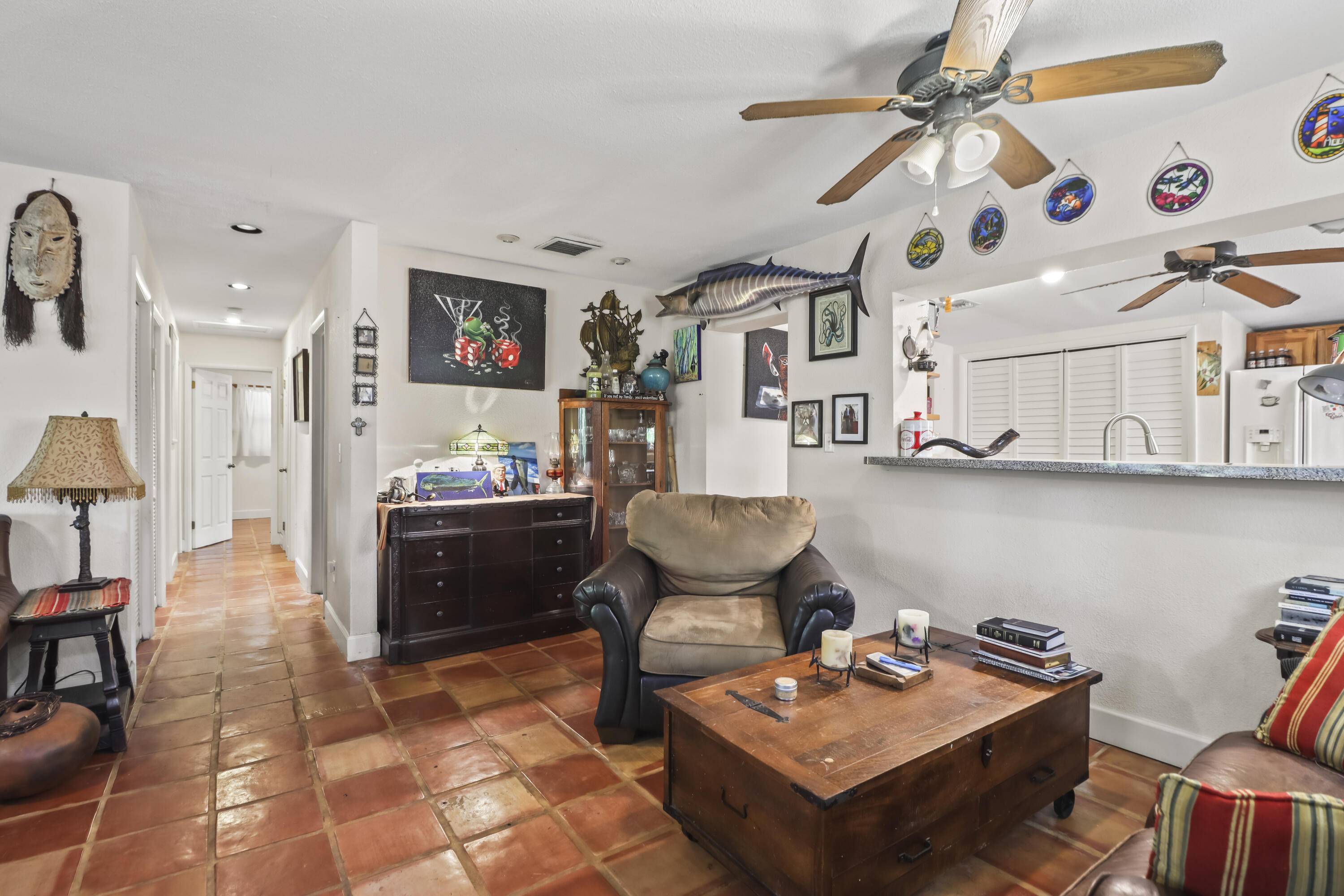 1406 Sunset Drive Key West, FL 33040 - Photo 6 of 23 a living room with stainless steel appliances kitchen island granite countertop furniture and a dining table