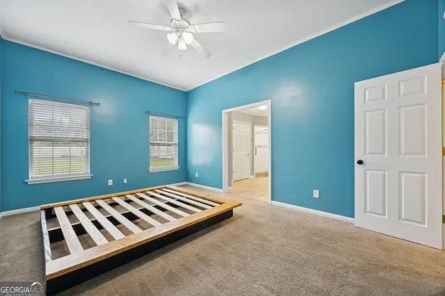 a bedroom with windows