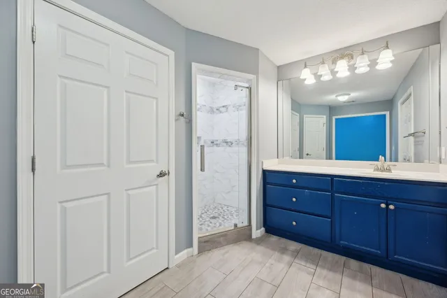 a bathroom with a granite countertop sink mirror and a