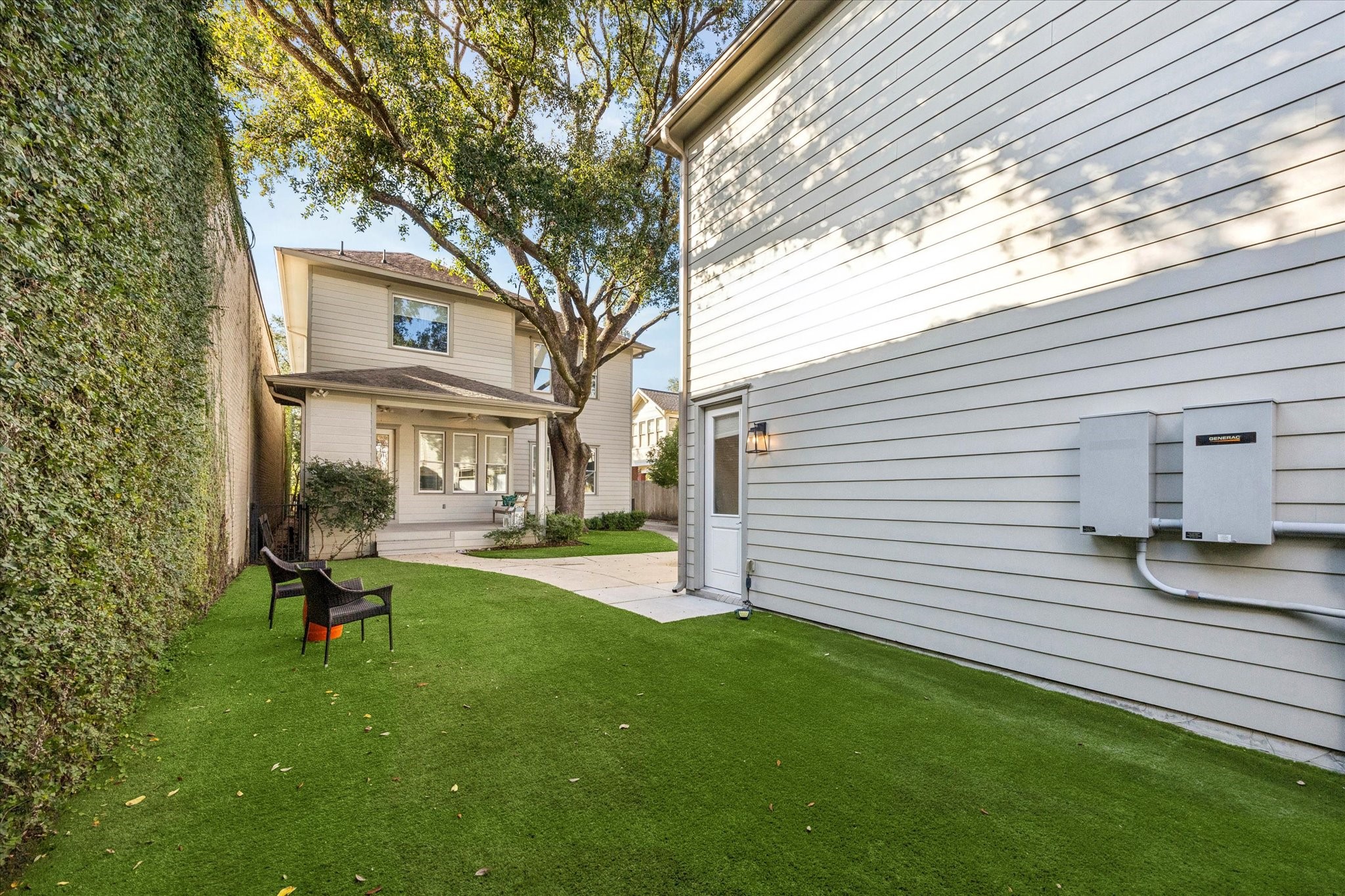 1226 Heights Boulevard Houston, TX 77008 - Photo 32 of 40 Low-maintenance turf yard provides green space for relaxing or play. Privacy fencing and mature trees enhance the peaceful outdoor setting.
