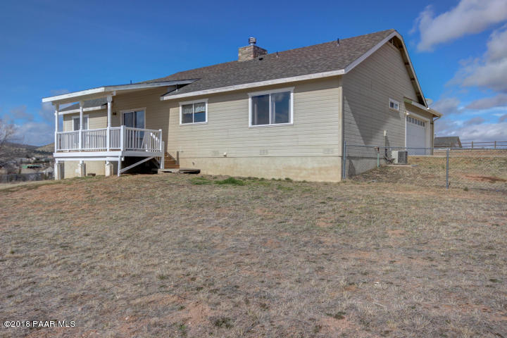 2165 West Lazy Ranch Road Chino Valley, AZ 86323 - Photo 15 of 17 a view of a house with a yard