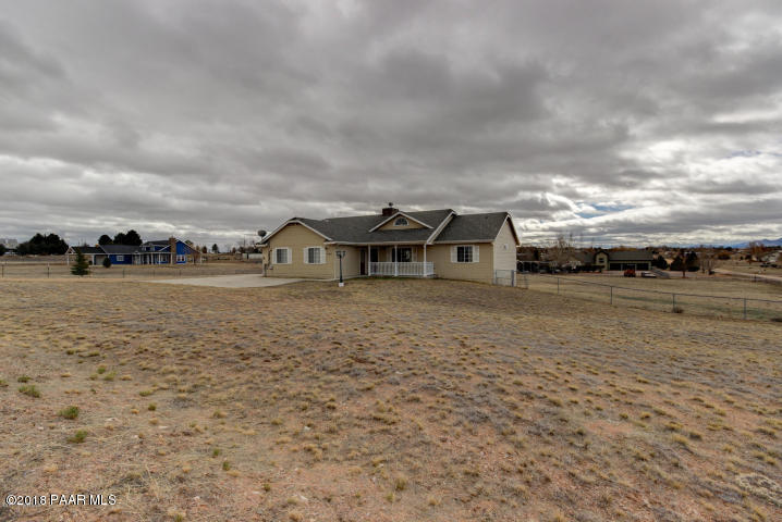2165 West Lazy Ranch Road Chino Valley, AZ 86323 - Photo 2 of 17 a view of a house with a yard