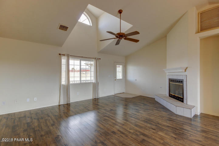 2165 West Lazy Ranch Road Chino Valley, AZ 86323 - Photo 4 of 17 a view of empty room with wooden floor and fan