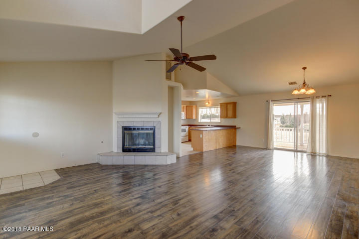 2165 West Lazy Ranch Road Chino Valley, AZ 86323 - Photo 5 of 17 a view of a kitchen with a sink a microwave and wooden floor