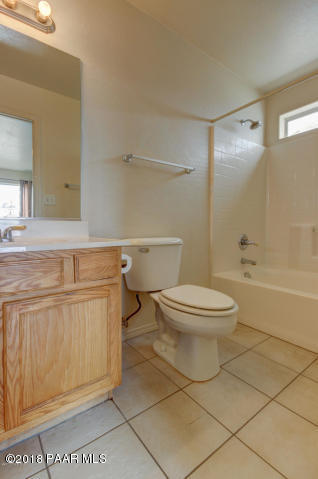 2165 West Lazy Ranch Road Chino Valley, AZ 86323 - Photo 10 of 17 a bathroom with a toilet a sink and a bathtub