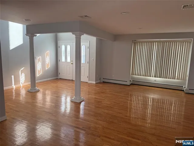 a view of a livingroom with wooden floor